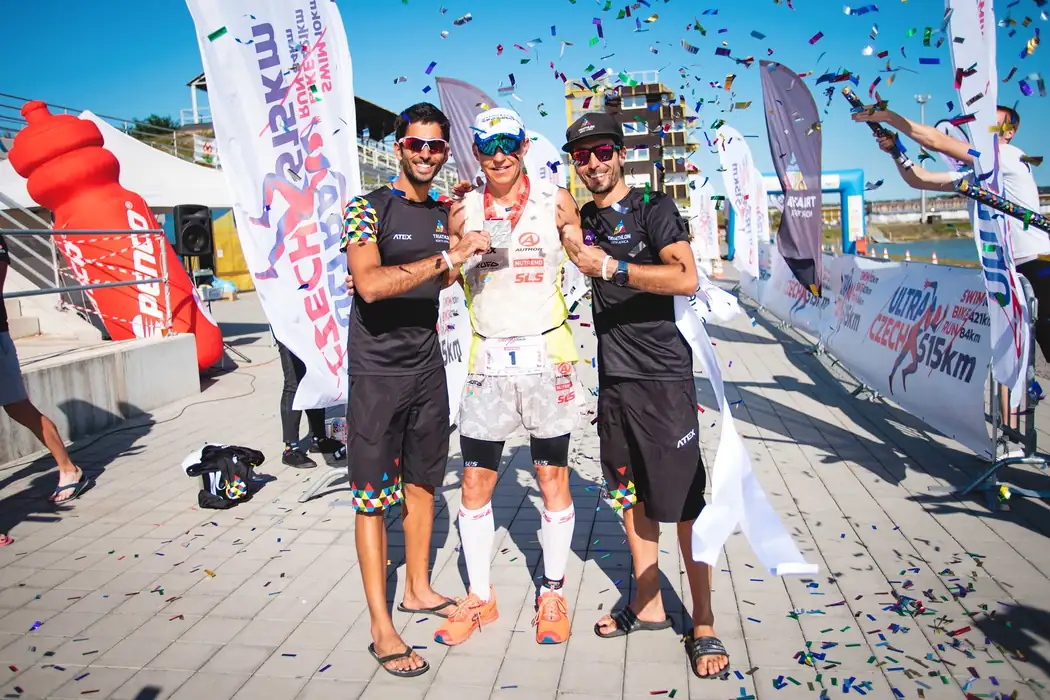 Winner at the finish with crew and confetti